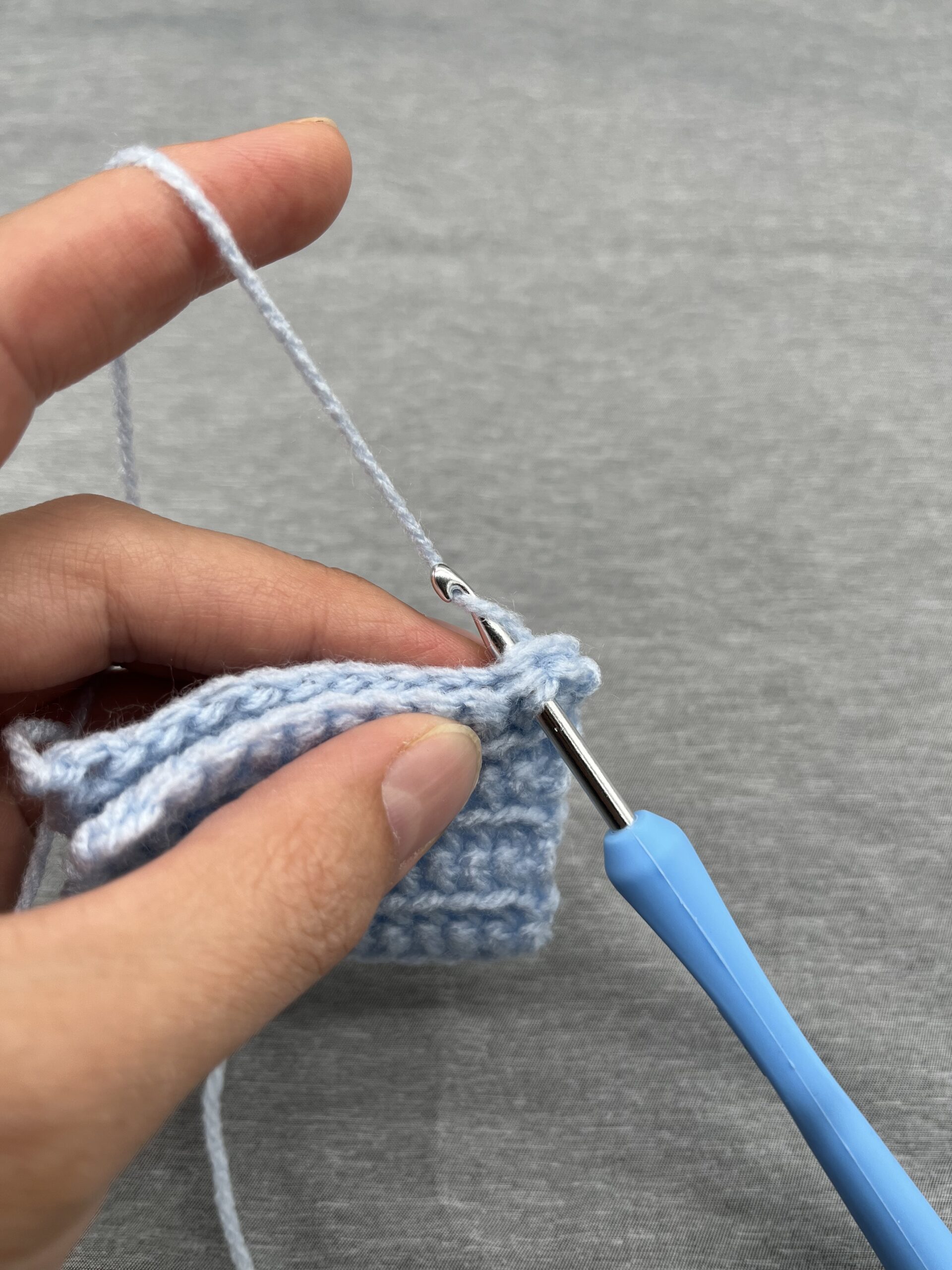 Crochet Baby Mittens Pattern Mittens at the folded cuff stage