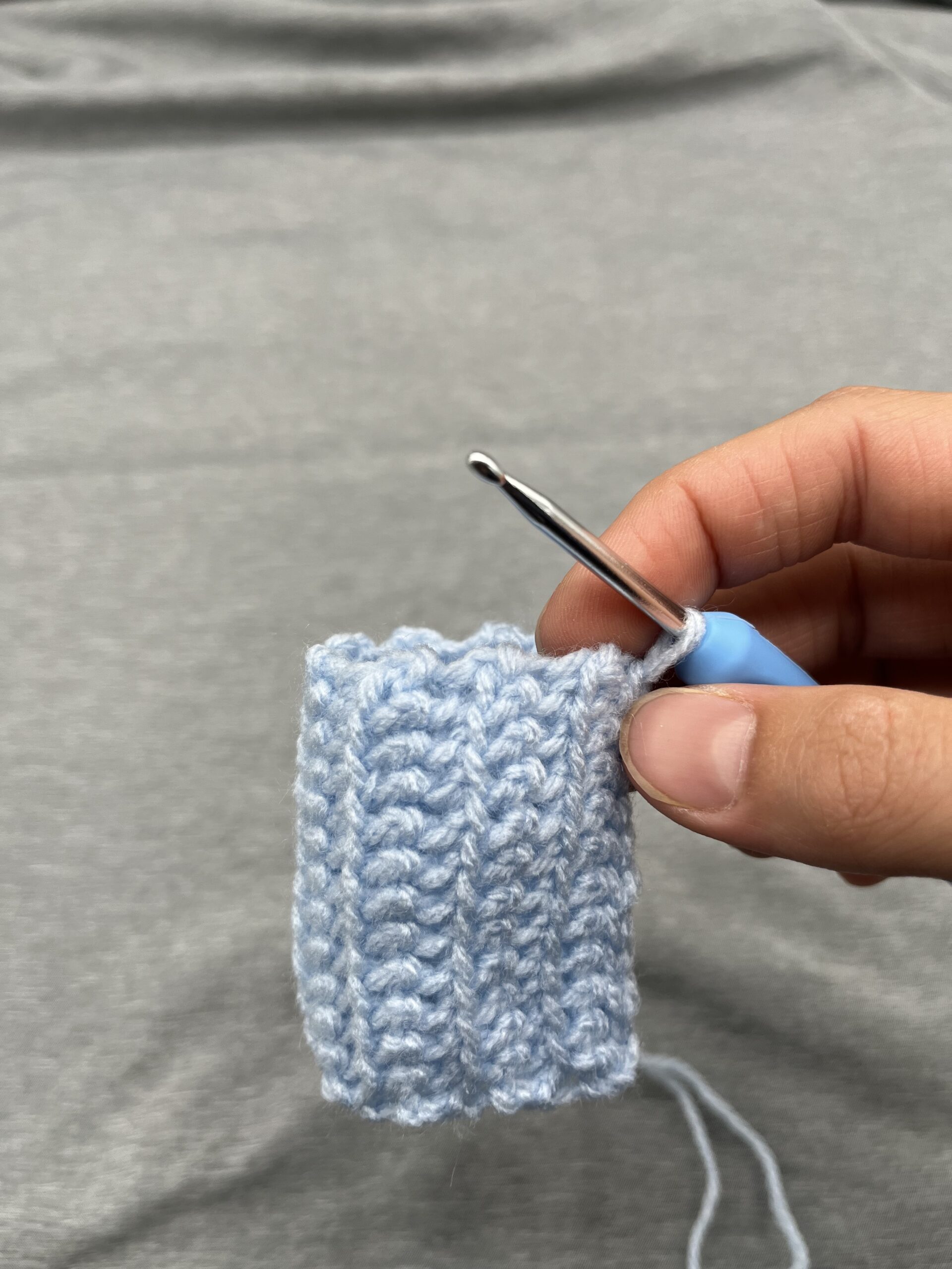 Crochet Baby Mittens at the folded stage