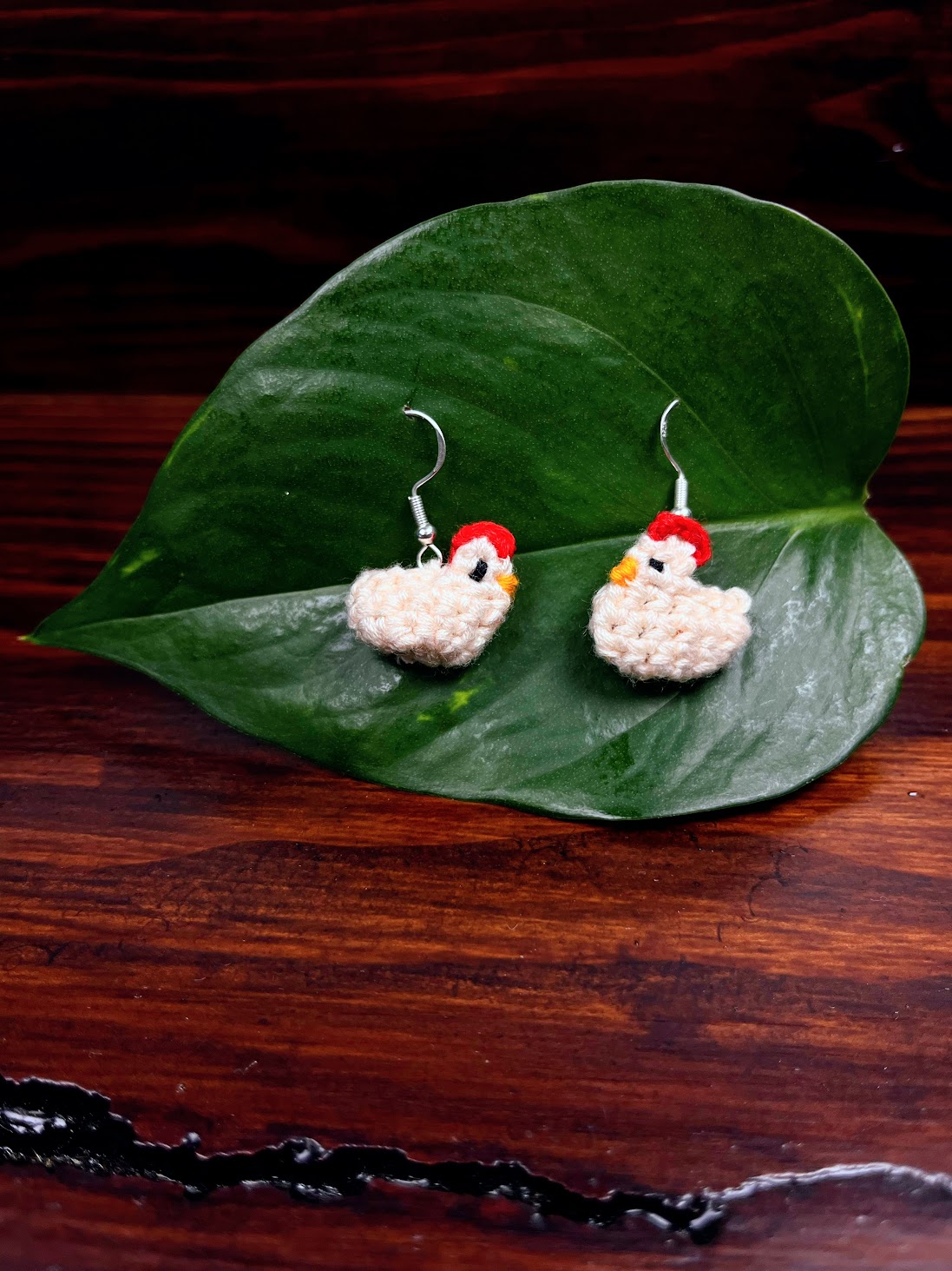 Chicken Amigurumi Earrings Hanging up After the Crochet Pattern is complete