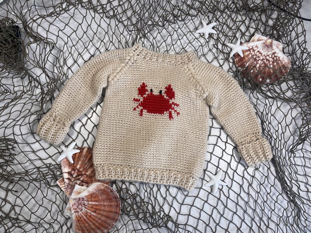 Crabby Baby Sweater Featuring Anadorable red crab on a baby sweater sizes 0-12