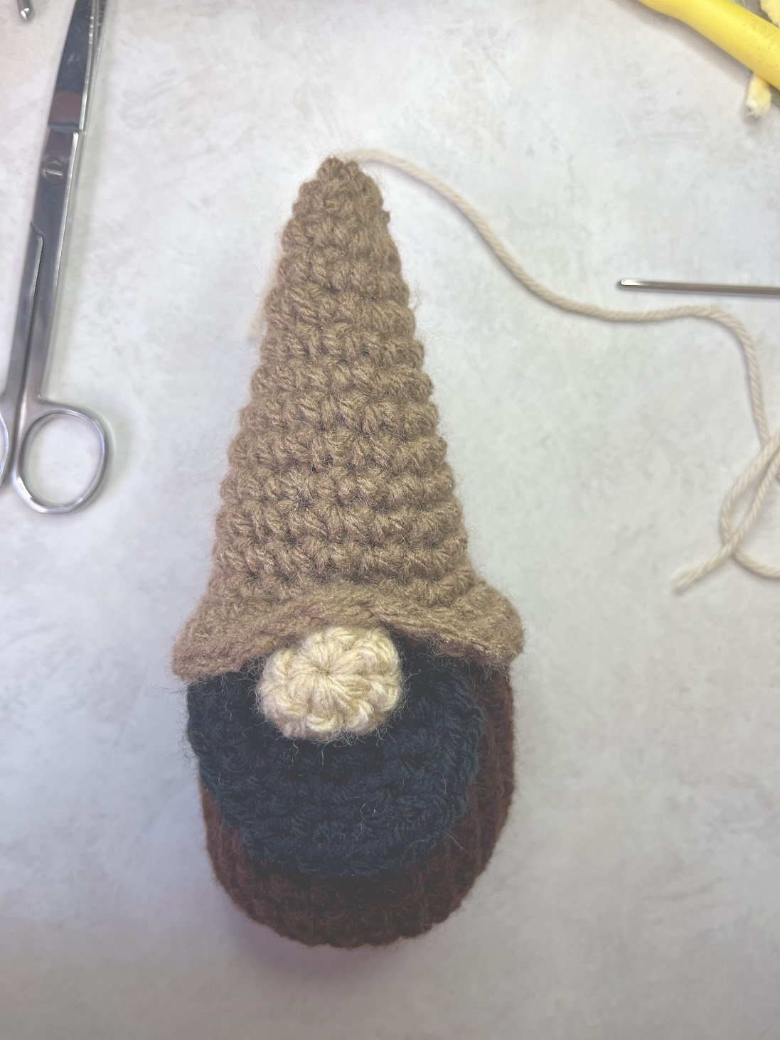 Gnome Nativity Crochet Pattern Character in the process of getting the nose stitched on