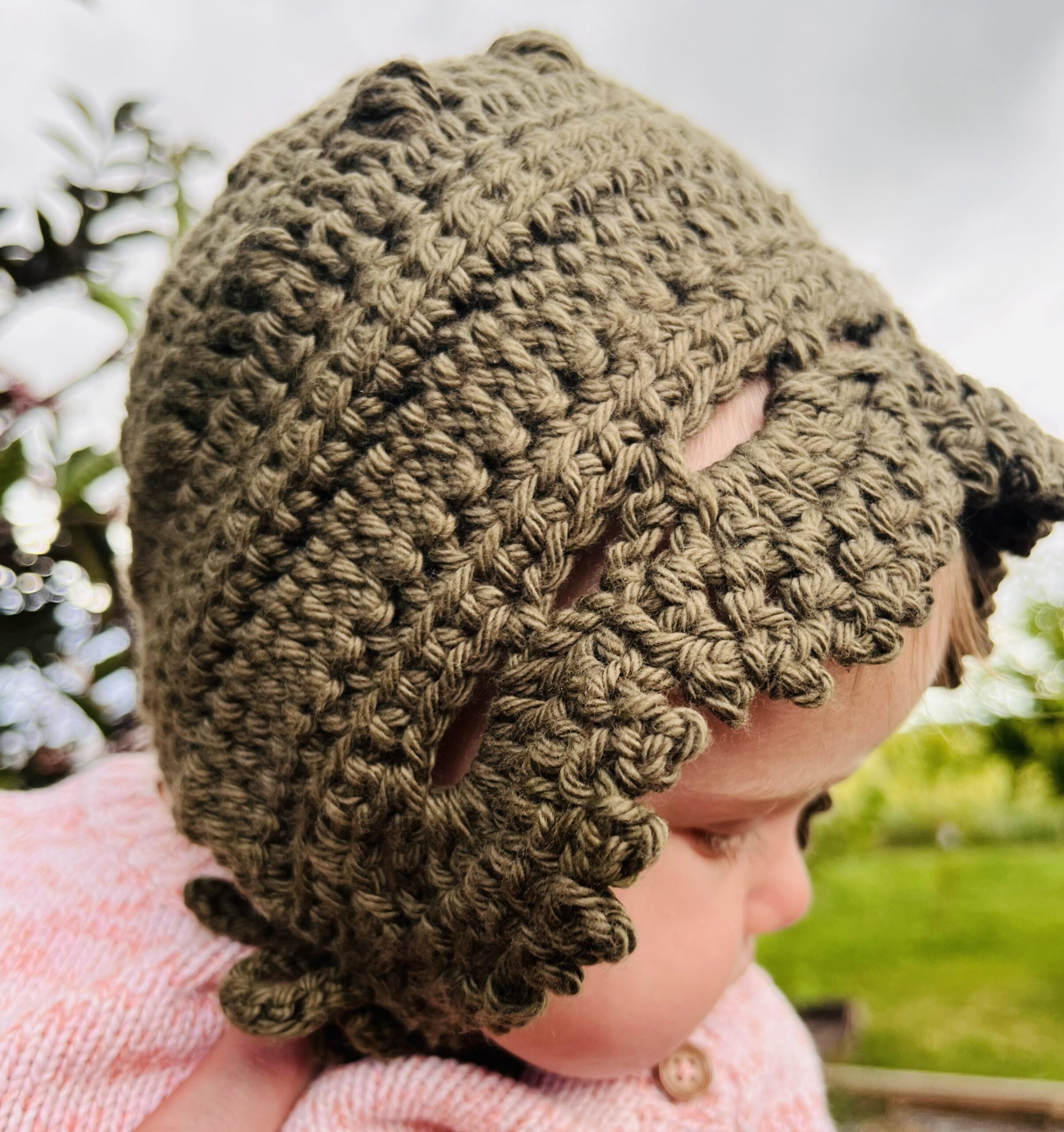 Simple Days Baby Bonnet Crochet Pattern Completed and being worn on an adorable baby.